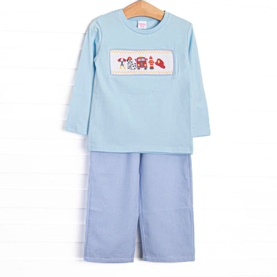 This set features a blue knit top, fire truck and puppy smocking, and blue gingham trim. Coordinating blue mini gingham pants to match.