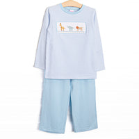 This set features blue striped fabric, jungle animal smocking, and long sleeves. Coordinating blue pants to match.