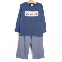 This set features navy fabric, duck smocking, and navy striped trim. Coordinating navy striped pants to match.
