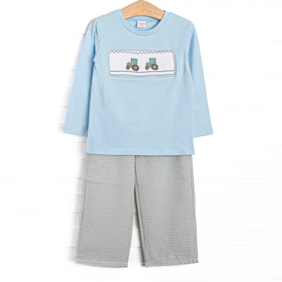  This set features a blue top, tractor smocking, and long sleeves. Coordinating green gingham pants to match. 