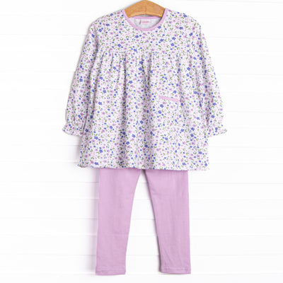 This set features a purple floral top with a front pocket and purple leggings to match.