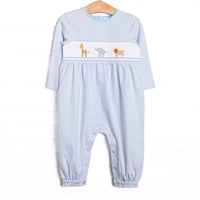 This romper features blue striped fabric, jungle animal smocking, and snaps along the stride to make changing a breeze.