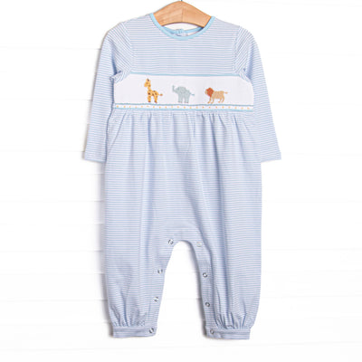 This romper features blue striped fabric, jungle animal smocking, and snaps along the stride to make changing a breeze.