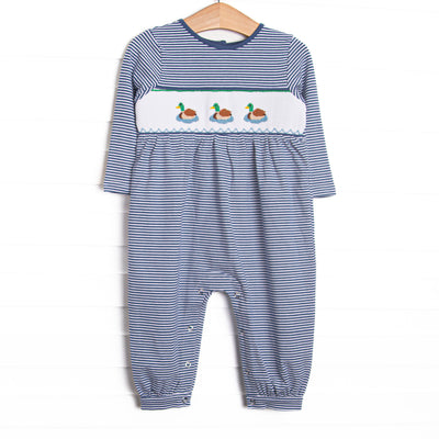 This romper features navy striped fabric, duck smocking, and snaps along the stride to make changing a breeze.