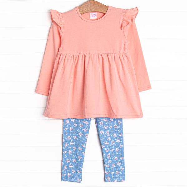 This set features a long sleeve pink knit top with shoulder ruffles and blue floral knit leggings to match.