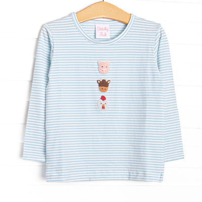  This top features a blue striped print, long sleeves, and a trio of farm animal embroideries. 