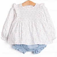This set features a blue floral print, a dainty smocking, and flutter trim. Coordinating blue diaper cover to match.