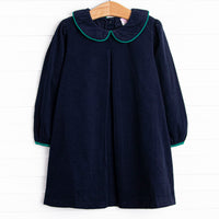  This dress features a blue corduroy material, a peter pan collar, and green trim. 
