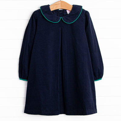  This dress features a blue corduroy material, a peter pan collar, and green trim. 