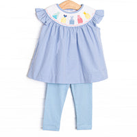This set features a blue mini gingham print top with flutter sleeves and the prettiest dresses smocking. Coordinating blue leggings to match.
