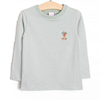 This top features green striped fabric, a Rudolph embroidery, and long sleeves.