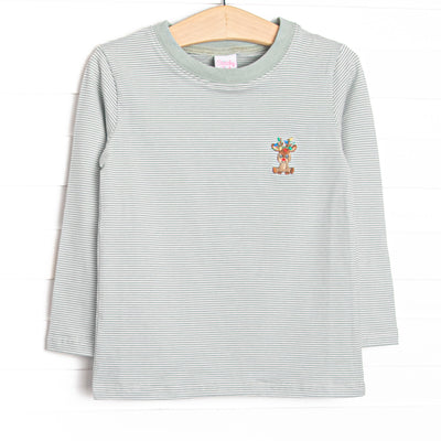 This top features green striped fabric, a Rudolph embroidery, and long sleeves.