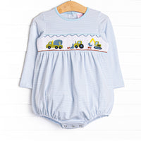 This bubble features a blue striped print, snaps on the stride, and a construction truck smocking.