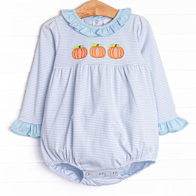  This bubble features a blue striped print, ruffle trim, and a trio of pumpkins appliques. 