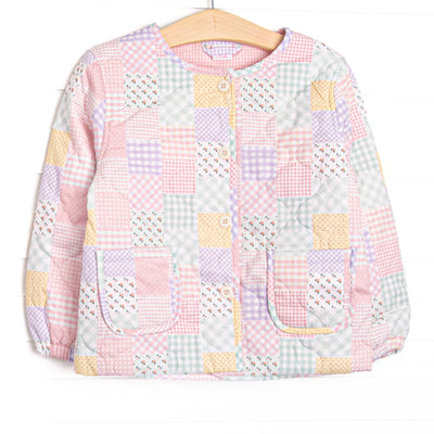 This coat features a pink quilt pattern, front buttons, and front pockets.