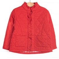 Quilted details, red fabric, a full-length zipper for easy use and front pockets to keep little hands warm.