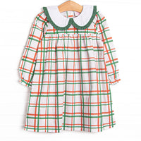  This dress features a red and green plaid, a peter pan collar, and green ruffle trim. 
