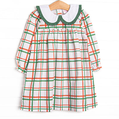  This dress features a red and green plaid, a peter pan collar, and green ruffle trim. 