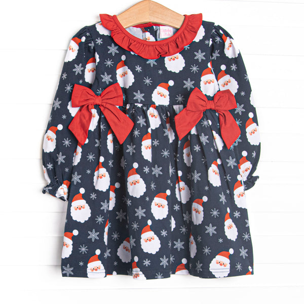  This dress features a Santa print, a ruffle collar, and red side ties. 