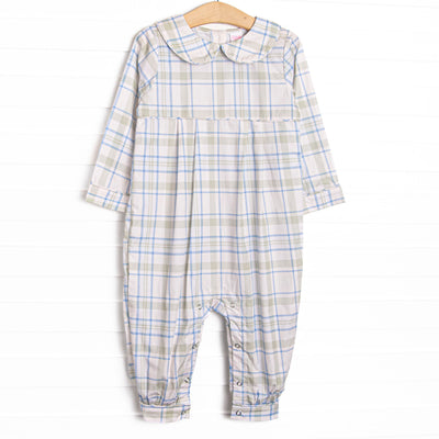 This romper features sage and blue plaid fabric, a Peter Pan collar, and snaps along the stride to make changing a breeze.