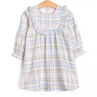 This dress features sage and blue plaid fabric, ruffle chest trim, and long sleeves