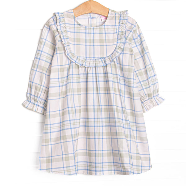 This dress features sage and blue plaid fabric, ruffle chest trim, and long sleeves