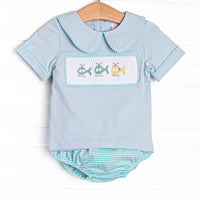 This set features a blue short sleeve top with a peter pan collar and a trio of helicopter smockings. Coordinating mint striped diaper cover to match.