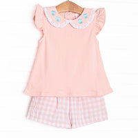  This set features a pink flutter sleeve top with a eyelet trimmed peter pan collar with floral embroidery. Coordinating pink check shorts to match. 