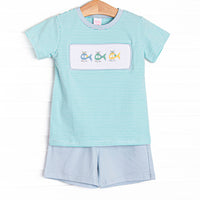 This set features a mint green striped top with a trio of helicopter smockings. Coordinating blue shorts to match