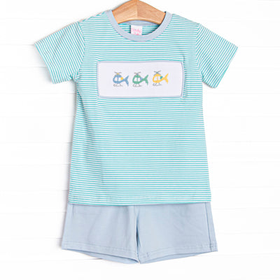 This set features a mint green striped top with a trio of helicopter smockings. Coordinating blue shorts to match