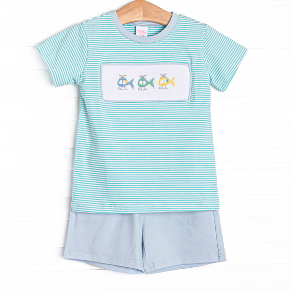 This set features a mint green striped top with a trio of helicopter smockings. Coordinating blue shorts to match