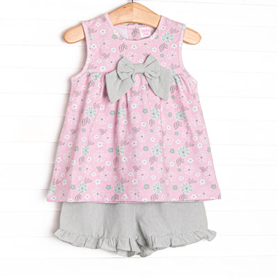 This set features a pink floral, green gingham bow details, and green gingham shorts to match.