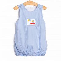  This bubble features a blue gingham print, front covered buttons and&nbsp; a steamboat smocking. 