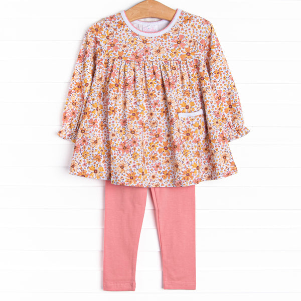 This set features a yellow floral print, a front pocket, and pink leggings to match.
