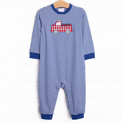  This romper features a blue striped print, snaps on the stride, and a firetruck applique. 