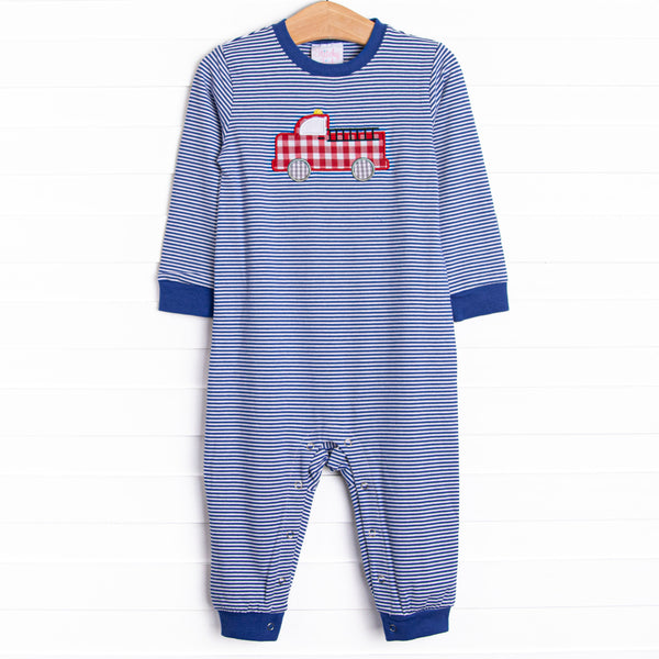  This romper features a blue striped print, snaps on the stride, and a firetruck applique. 