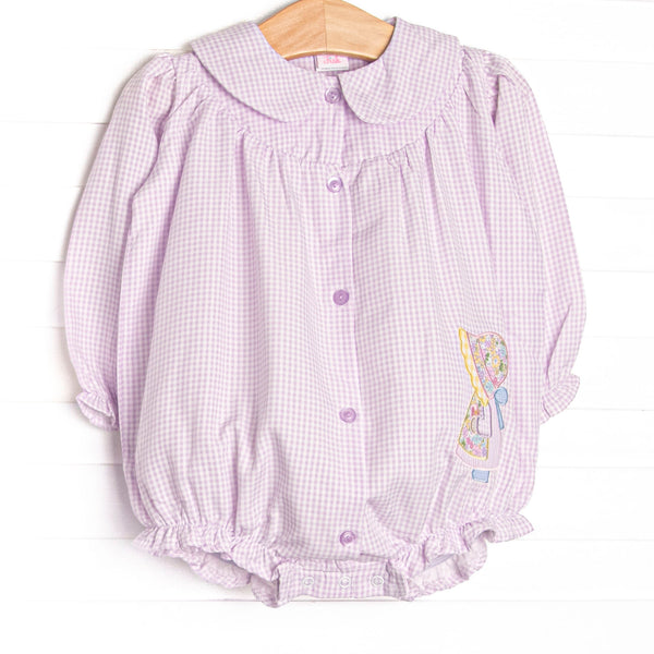 This bubble features purple gingham fabric, a Peter Pan collar, a little girl applique, and front buttons.