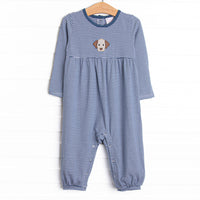  This romper features a navy blue striped material, a puppy applique and snaps on the stride. 