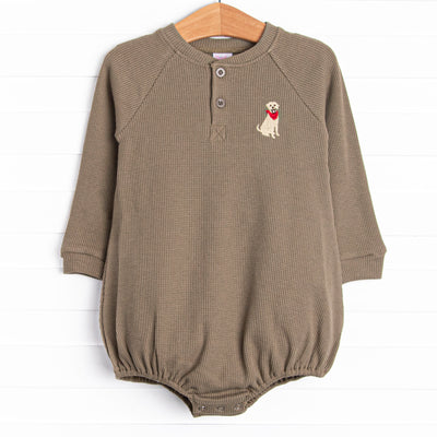 This bubble features a green waffle knit material, front buttons, and a dog embroidery.