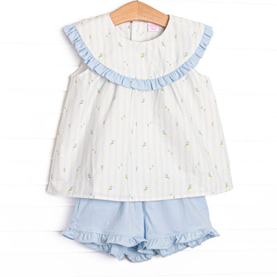 This set features features blue floral and striped print, a blue ruffle edged bib collar, and blue ruffle shorts to match.