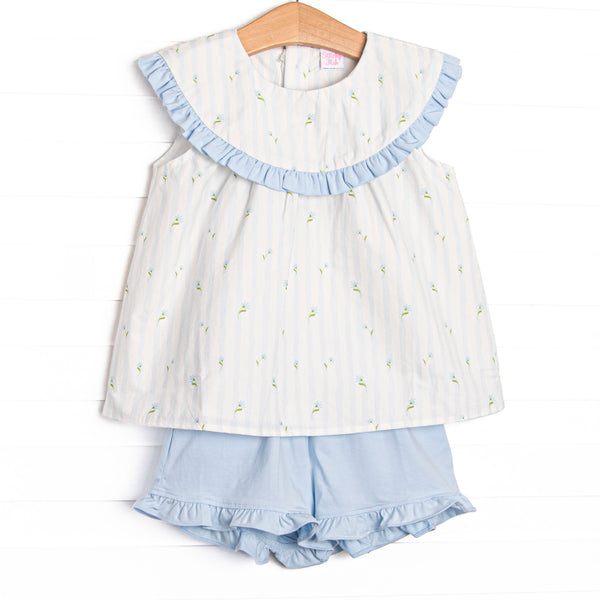 This set features features blue floral and striped print, a blue ruffle edged bib collar, and blue ruffle shorts to match.