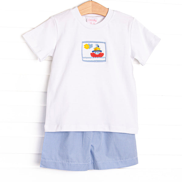 This set features a short sleeve top with a steamboat smocking and blue gingham shorts to match.