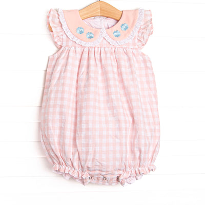  This bubble features a pink check print, flutter sleeves, and&nbsp; a ruffle peter pan collar with floral embroidery.