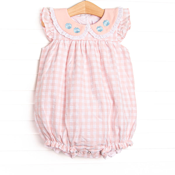  This bubble features a pink check print, flutter sleeves, and&nbsp; a ruffle peter pan collar with floral embroidery.