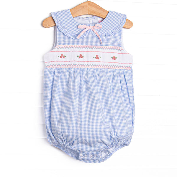 This bubble featurse a blue check print, a dainty pink bow, and a rose smocking.