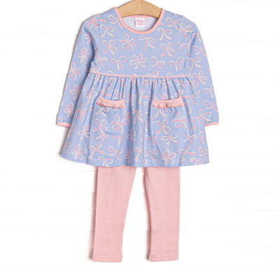  This set features a bow print, pink picot trim, and front ruffle pockets. Coordinating pink leggings to match. 