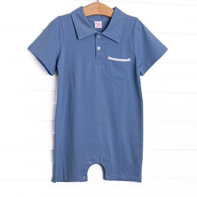 This romper features a blue knit material, front pocket, and a polo collar.