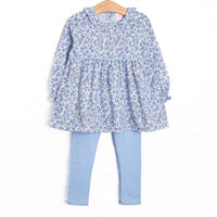 This set features a blue floral print, a ruffle collar, and blue leggings to match.