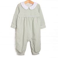  This romper features a green plaid print, a peter pan collar, and snaps on the stride. 
