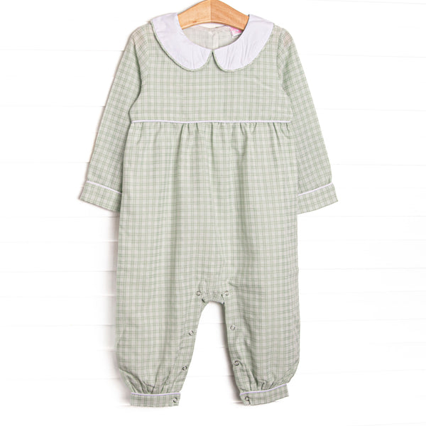  This romper features a green plaid print, a peter pan collar, and snaps on the stride. 